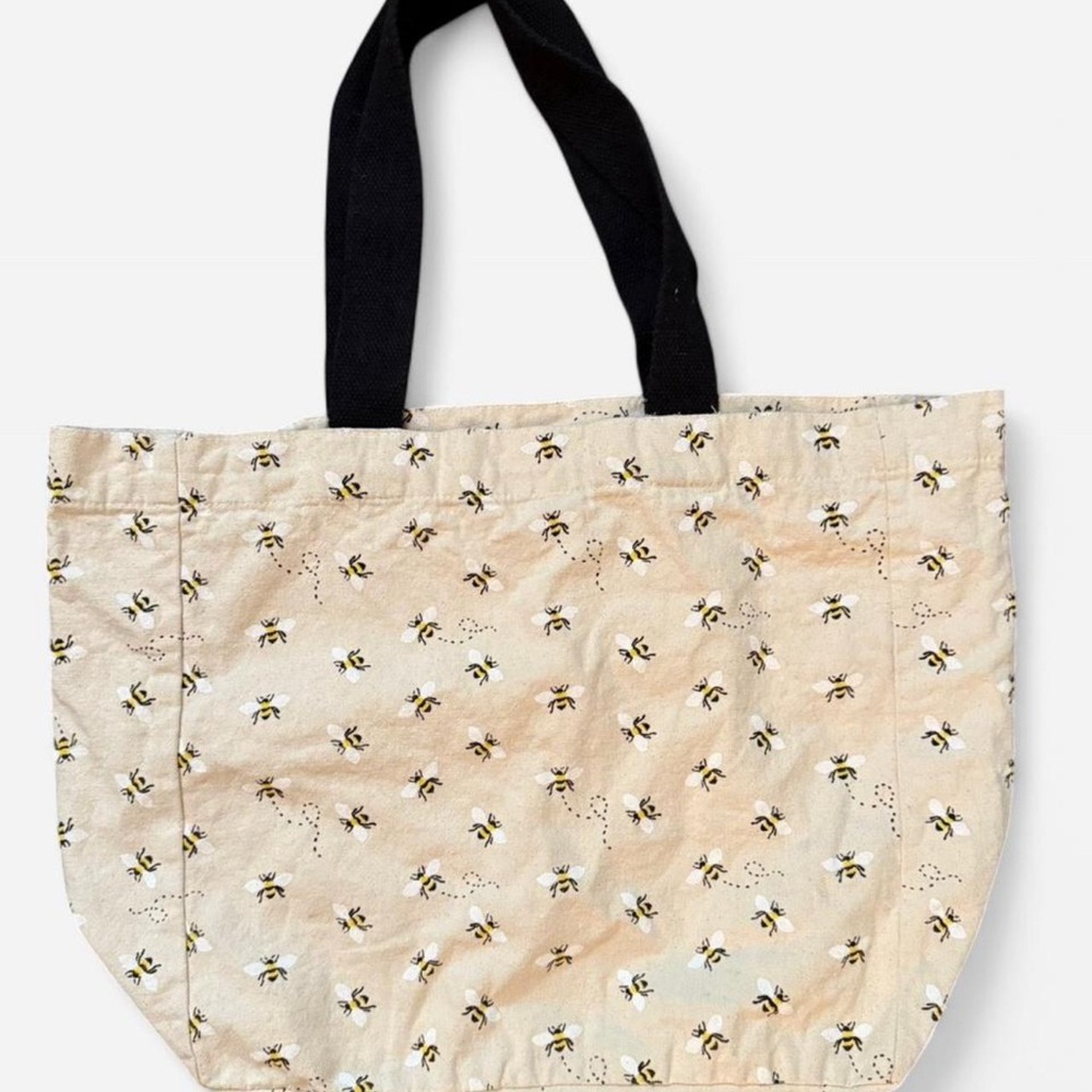 Cream and black bee print tote bag. Print is all over front and back. 14”x13”x5”
